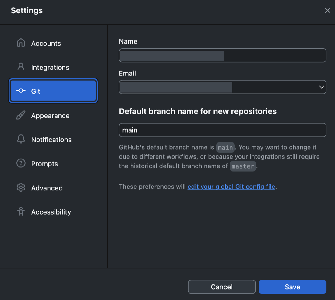 GitHub Desktop&rsquo;s Settings window with Git selected in the left sidebar. The pane on the right holds a Name field and an Email field, both blanked out here, above a field setting the default branch name for new repositories to main. Cancel and Save buttons sit at the bottom.